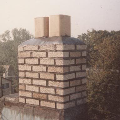 After: the restored brick chimney with a new cap